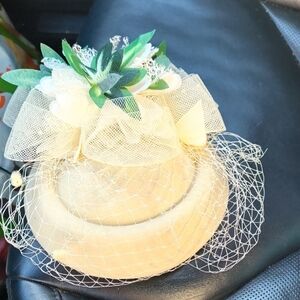 Chic Cream Fascinator with Green Details